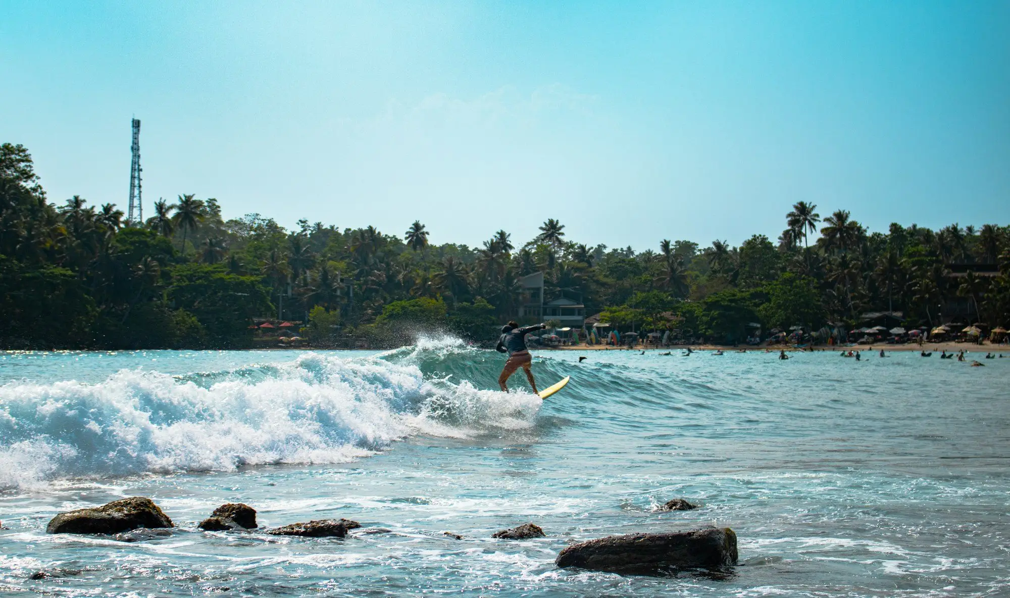 Surfer at Hiriketiya bay (near Tangalle)